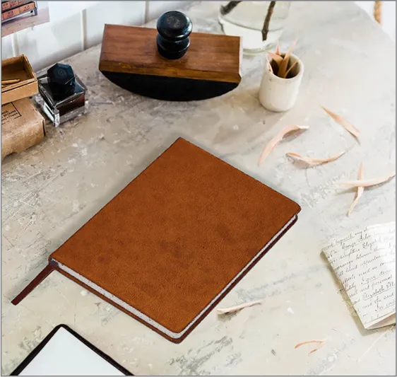 A brown book sitting on top of a table.