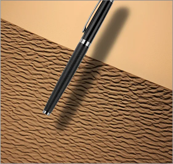 A pen sitting on top of a piece of paper.